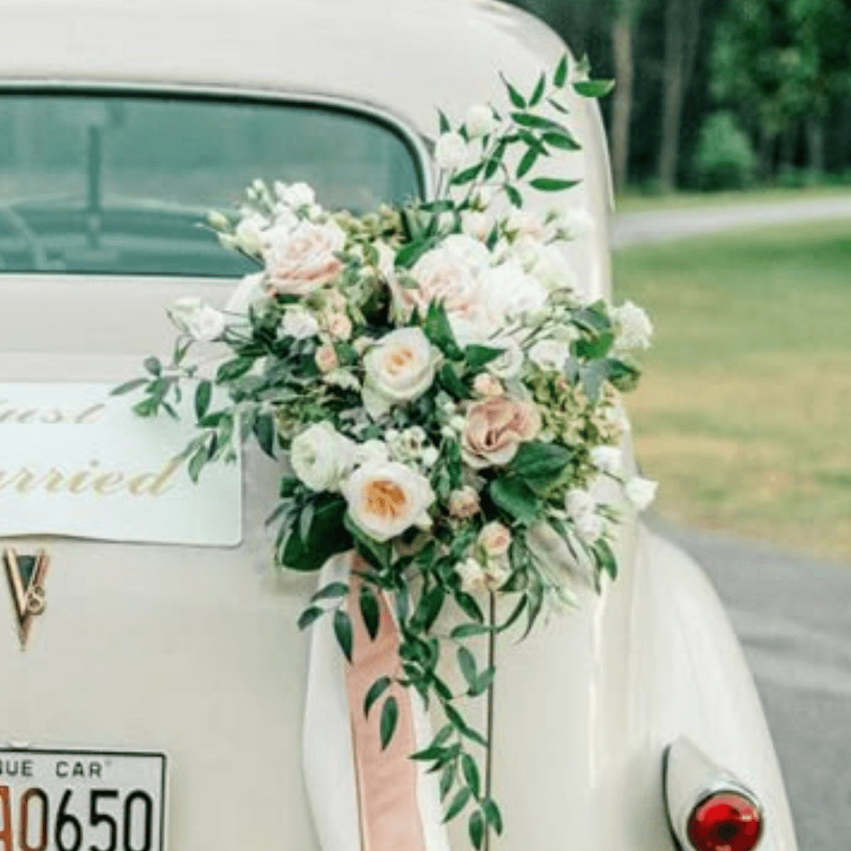 Blush and white car bouquet on vintage car